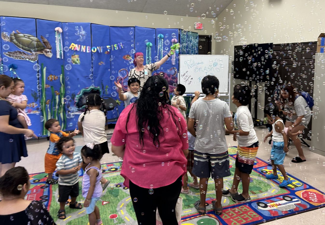 Families and children take part in a neighborhood activity