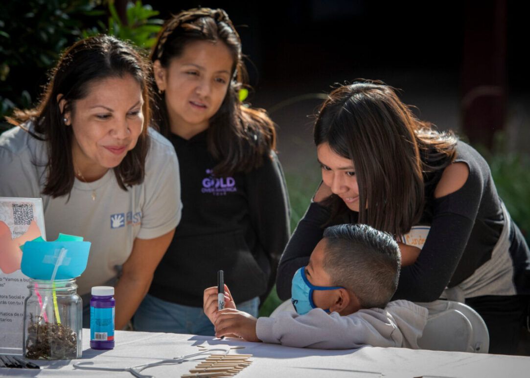 Families and community representatives sharing an activity at a First 5 gathering